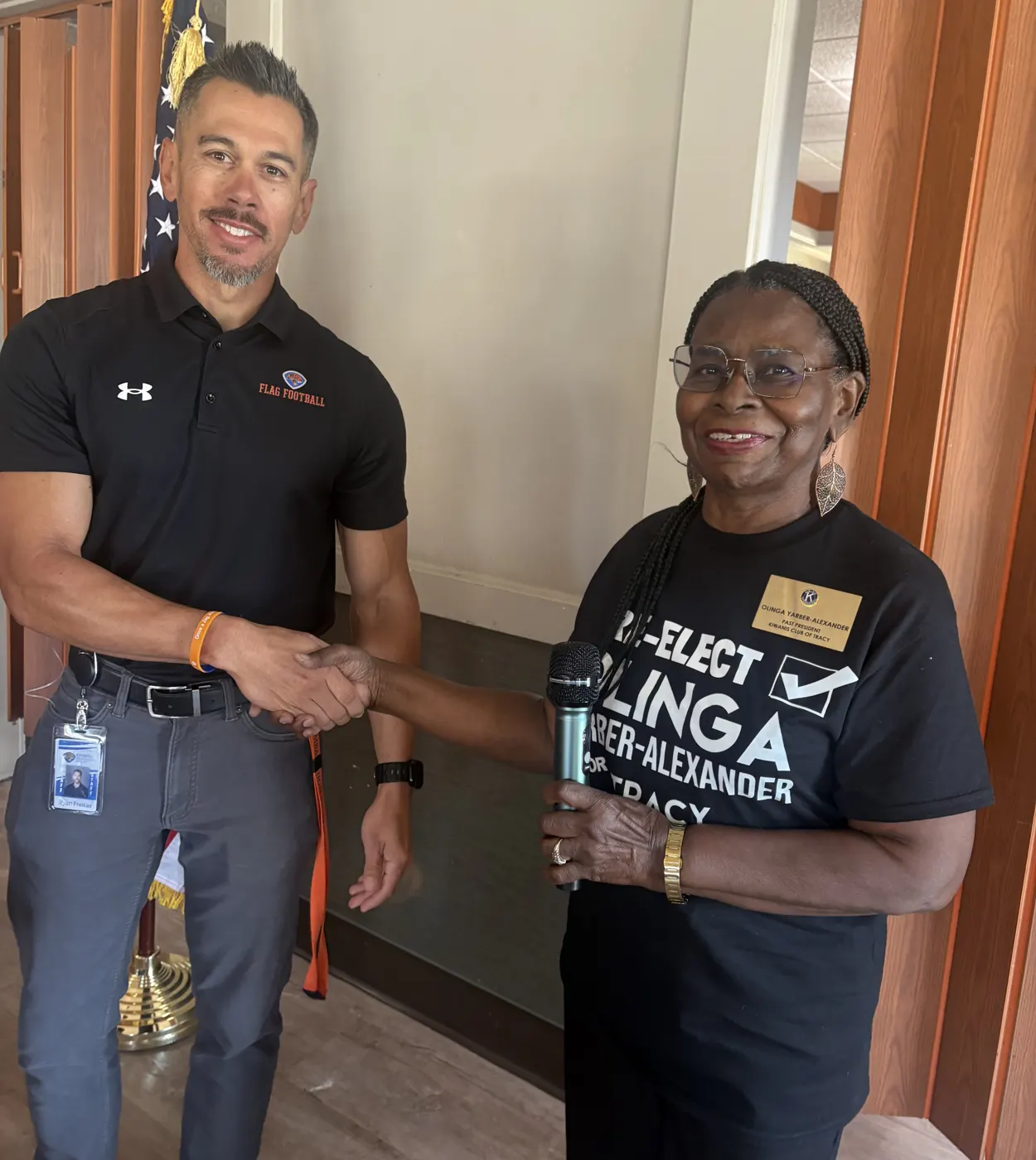 Olinga thanking a guest speaker at a Kiwanis Club of Tracy meeting